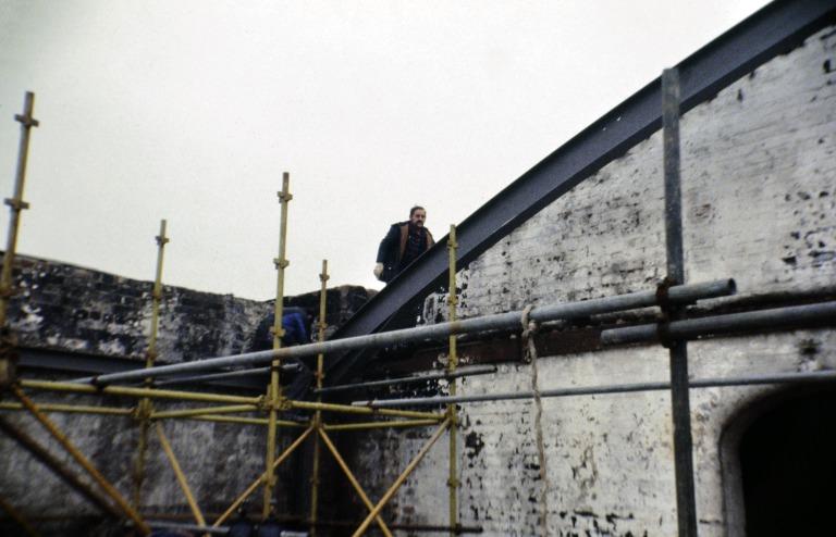 Photograph of renovation of Albert Dock, Liverpool, Block D, later Merseyside Maritime Museum, new fourth floor roof installation after demolition of cold storage roof addition. card