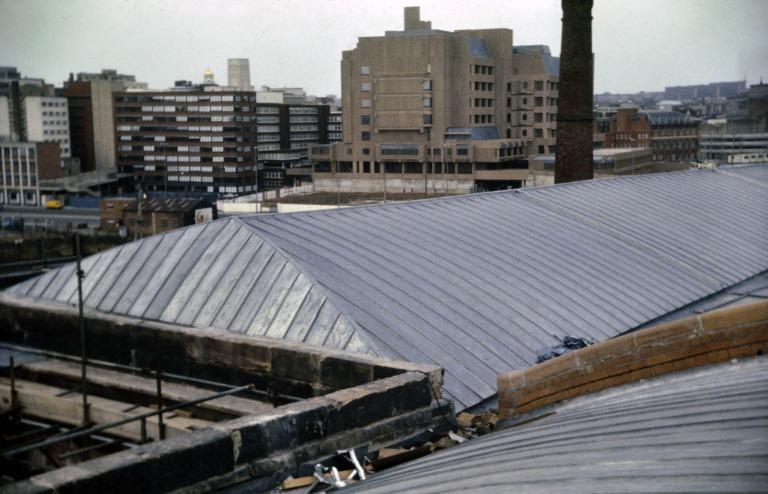 Photograph of renovation of Albert Dock, Liverpool, Block D, later Merseyside Maritime Museum, north east corner roof completed with lead coated stainless steel roof sheets. card