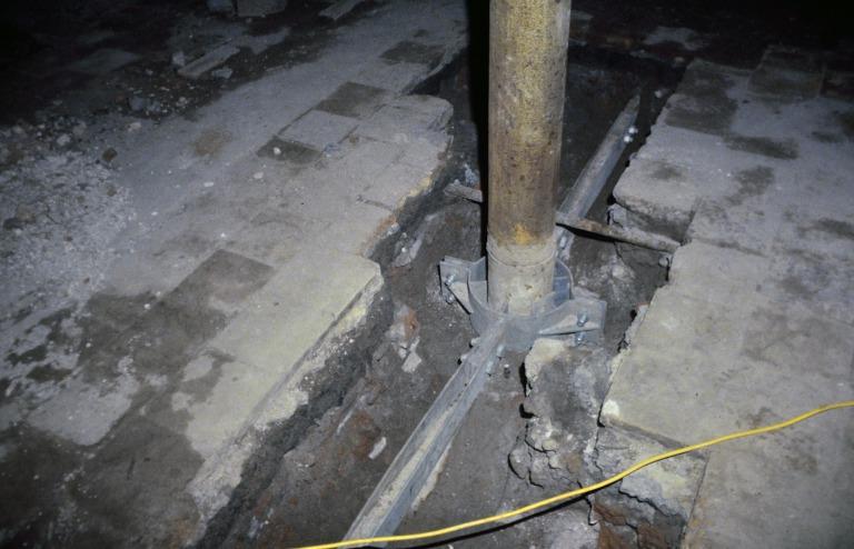 Photograph of renovation of Albert Dock, Liverpool, Block D, later Merseyside Maritime Museum, second or third floor, new sub-floor steel collar and arms, ties, to cast iron columns replacing existing similar iron. card