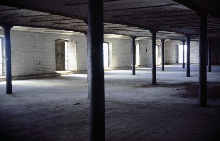 Photograph of renovation of Albert Dock, Liverpool, Block D, later Merseyside Maritime Museum, fourth floor, view showing grid of cast iron columns, inverted Y-shaped curved cast iron beams and vaulted brick arches with cast iron tie bars. card