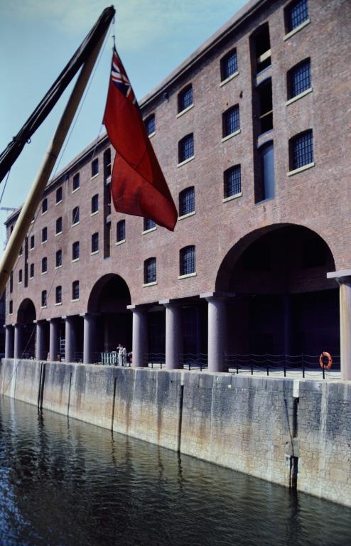 Photograph of renovation of Albert Dock, Liverpool, Block D, later Merseyside Maritime Museum, near completed south elevation from Block E across Albert Dock. card