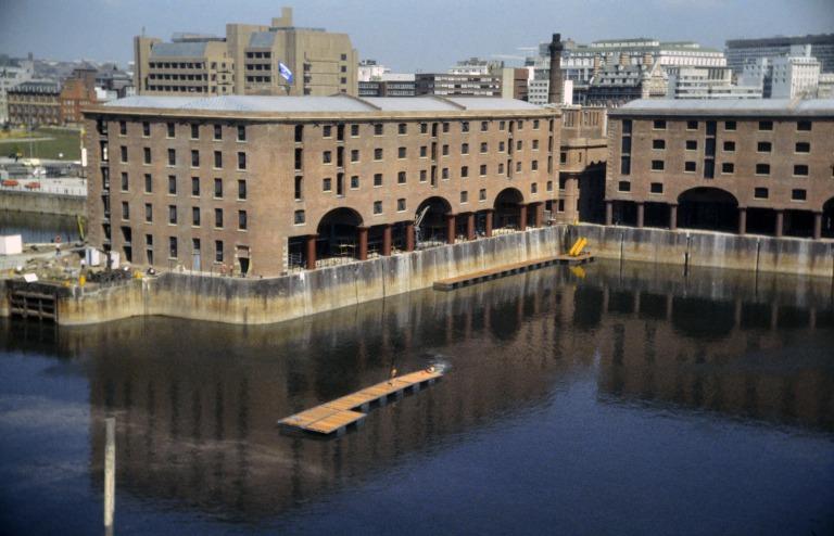 Photograph of renovation of Albert Dock, Liverpool, Block D, later Merseyside Maritime Museum and Block E with near completed section of south elevation Block D and west and south elevations Block E. card