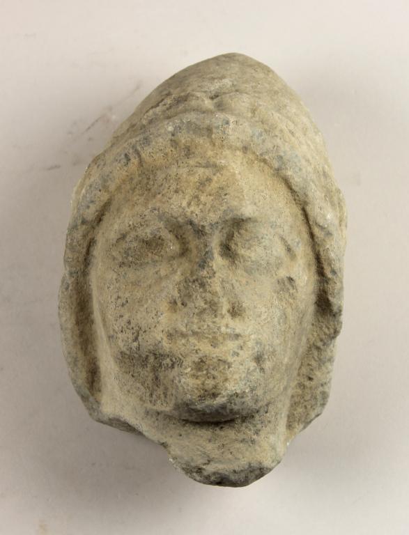 Head from a votive statuette card
