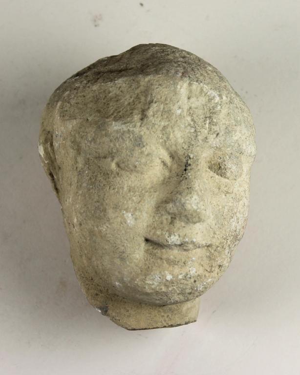 Head from a votive statuette card
