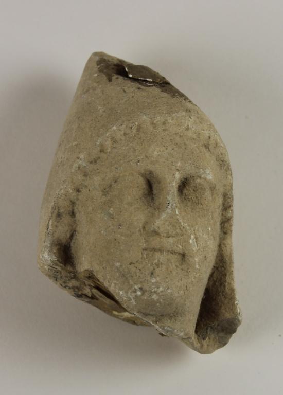Female head from a votive statuette card