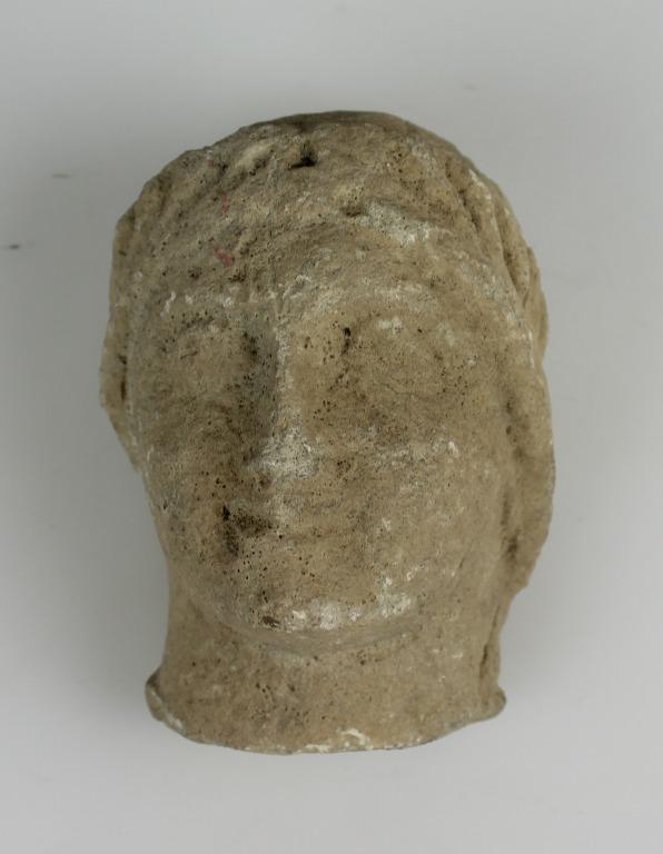 Head from a votive statue card