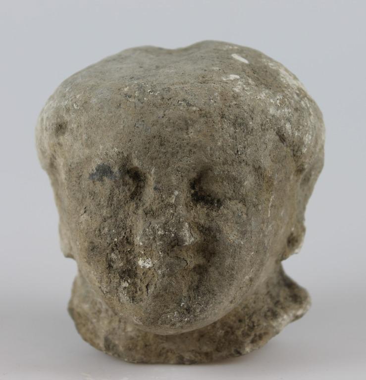 Head from a votive statue card