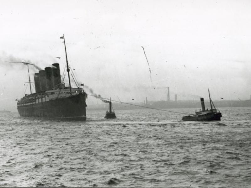 Photograph of Unidentified four funnel cunarder on tow in Mersey ...